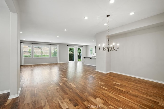 35414 Laurel Tree Ct, Winchester, CA 92596 - unfurnished living room featuring wood finished floors, recessed lighting, and a chandelier