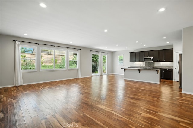 35414 Laurel Tree Ct, Winchester, CA 92596 - unfurnished living room featuring wood finished floors and recessed lighting