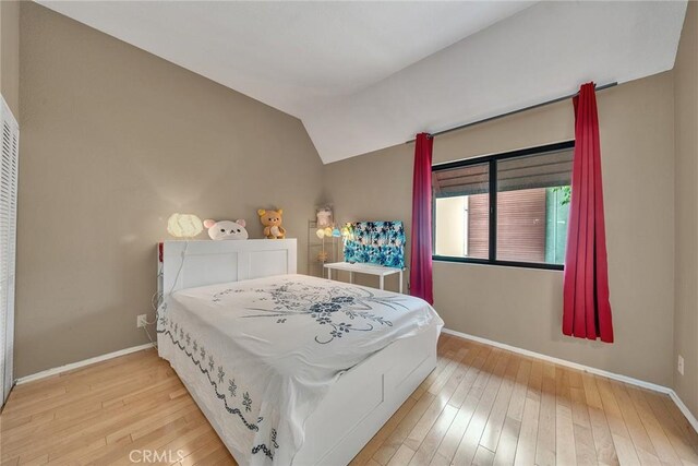 230 Bethany Rd Unit 127, Burbank, CA 91504 - bedroom featuring hardwood / wood-style flooring, baseboards, and lofted ceiling