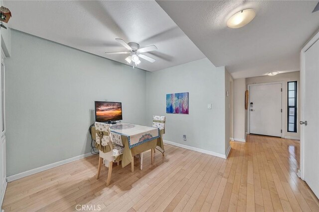 230 Bethany Rd Unit 127, Burbank, CA 91504 - dining room featuring baseboards, light wood-style floors, and a ceiling fan