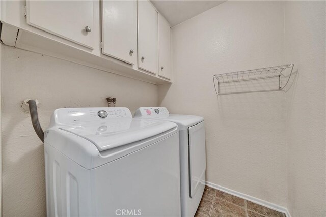 230 Bethany Rd Unit 127, Burbank, CA 91504 - washroom with washing machine and dryer, cabinet space, and baseboards