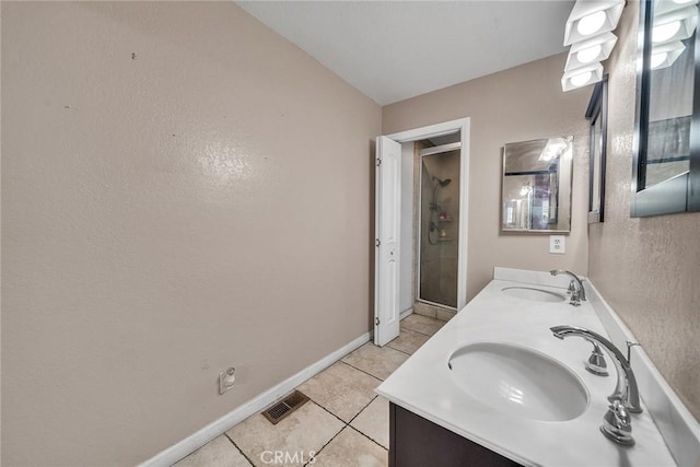 230 Bethany Rd Unit 127, Burbank, CA 91504 - full bathroom with tile patterned flooring, double vanity, baseboards, and a shower with shower door