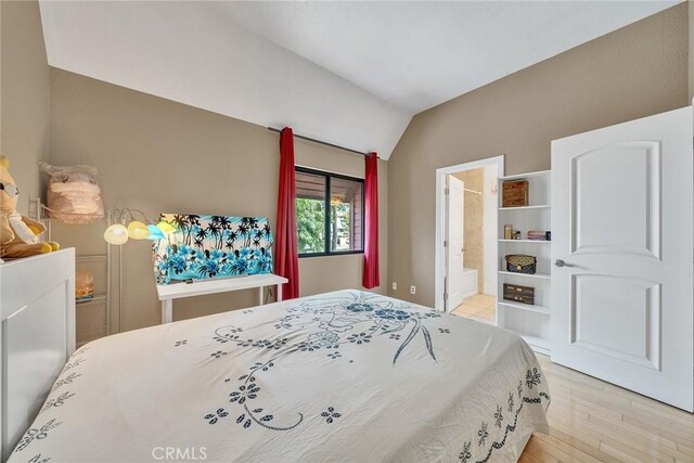 230 Bethany Rd Unit 127, Burbank, CA 91504 - bedroom with lofted ceiling, light wood finished floors, and ensuite bath