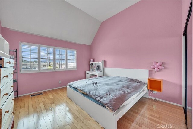 230 Bethany Rd Unit 127, Burbank, CA 91504 - bedroom featuring lofted ceiling, wood-type flooring, and baseboards