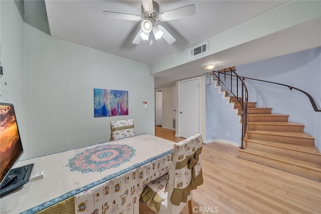 230 Bethany Rd Unit 127, Burbank, CA 91504 - dining area featuring stairway, light wood-style flooring, and a ceiling fan