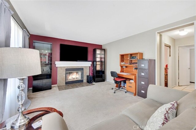 2825 W Newgrove St, Lancaster, CA 93536 - carpeted living room featuring a tiled fireplace