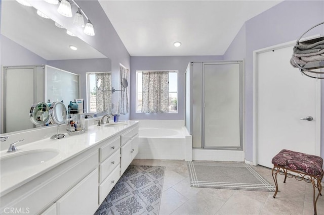 2825 W Newgrove St, Lancaster, CA 93536 - bathroom featuring a garden tub, double vanity, a stall shower, tile patterned flooring, and vaulted ceiling