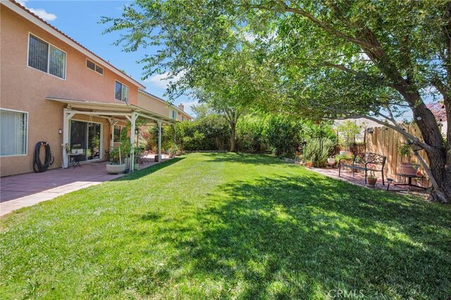 2825 W Newgrove St, Lancaster, CA 93536 - view of yard featuring a patio
