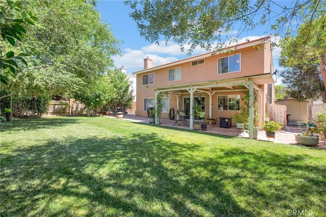 2825 W Newgrove St, Lancaster, CA 93536 - back of house featuring stucco siding, a chimney, and a patio area