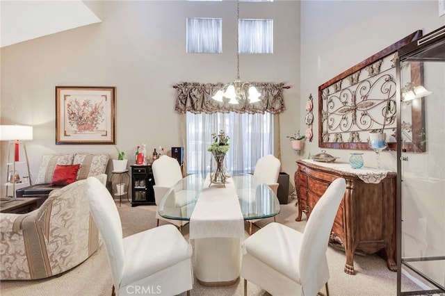 2825 W Newgrove St, Lancaster, CA 93536 - dining room with light carpet, a chandelier, and a towering ceiling