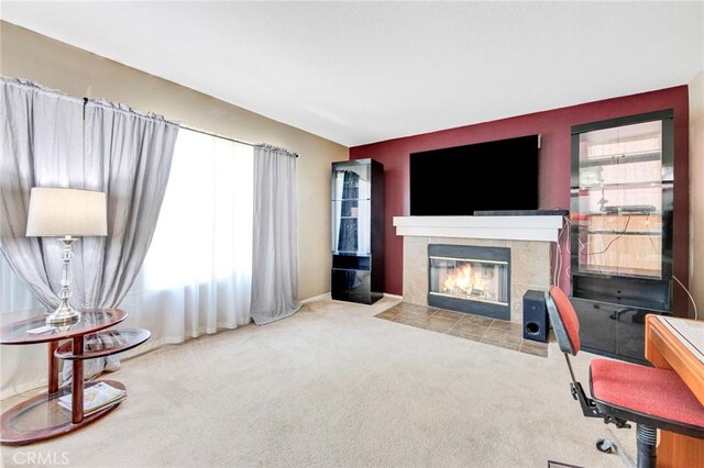 2825 W Newgrove St, Lancaster, CA 93536 - living room featuring a tile fireplace and carpet flooring