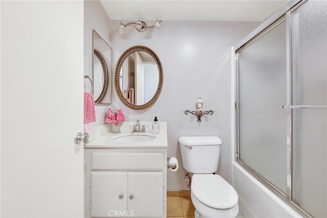 2825 W Newgrove St, Lancaster, CA 93536 - full bathroom featuring toilet, vanity, combined bath / shower with glass door, and tile patterned flooring