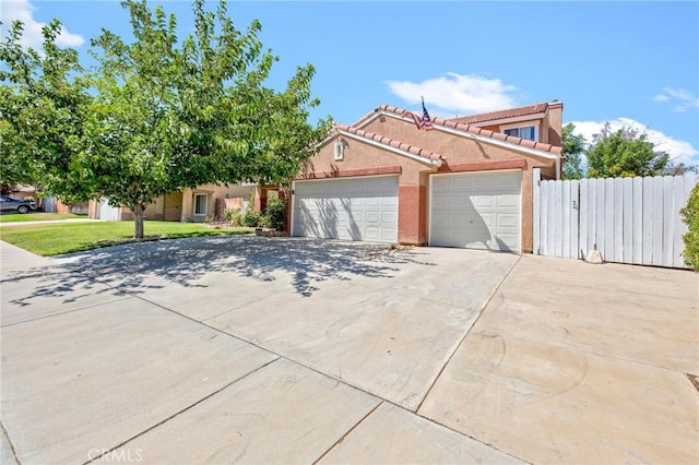 2825 W Newgrove St, Lancaster, CA 93536 - view of front of house with concrete driveway, an attached garage, a tile roof, and stucco siding