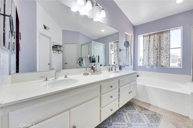 2825 W Newgrove St, Lancaster, CA 93536 - bathroom with plenty of natural light, double vanity, a bath, and tile patterned floors