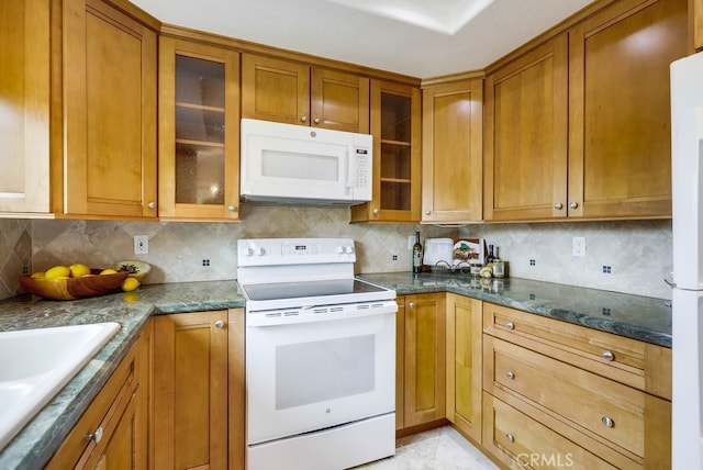 253 Gallery Way, Tustin, CA 92782 - kitchen featuring white appliances, backsplash, brown cabinets, a sink, and glass insert cabinets