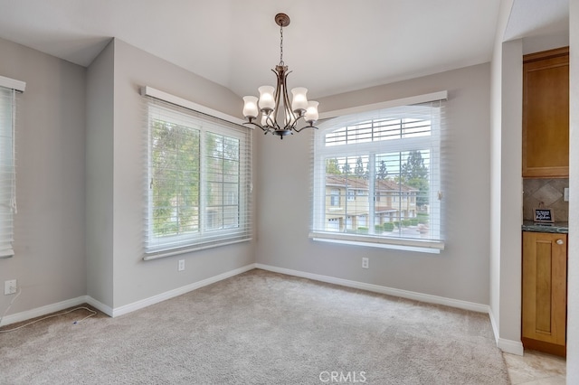 253 Gallery Way, Tustin, CA 92782 - unfurnished dining area with a chandelier, light carpet, and baseboards