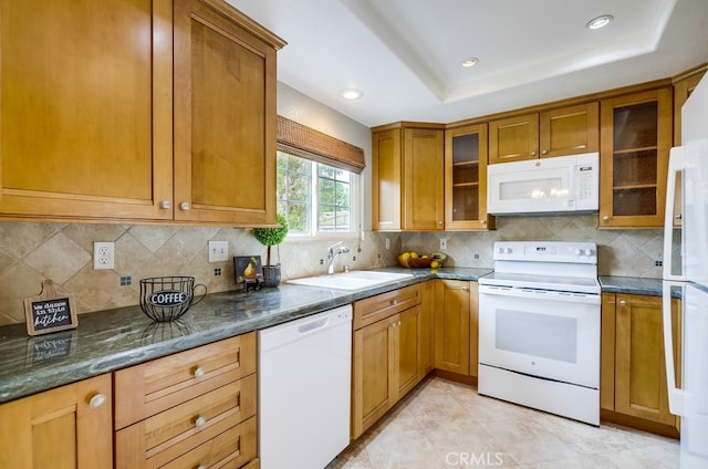 253 Gallery Way, Tustin, CA 92782 - kitchen with white appliances, a sink, brown cabinetry, tasteful backsplash, and dark stone countertops