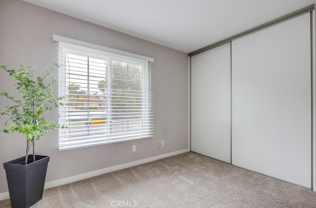 253 Gallery Way, Tustin, CA 92782 - unfurnished bedroom with carpet floors, baseboards, and a closet