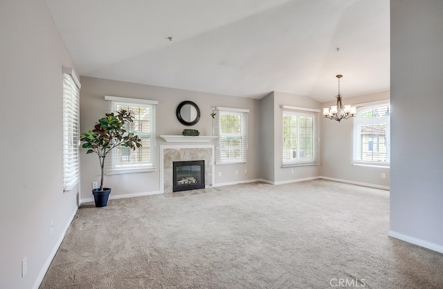 253 Gallery Way, Tustin, CA 92782 - unfurnished living room featuring lofted ceiling, a chandelier, carpet floors, a high end fireplace, and baseboards