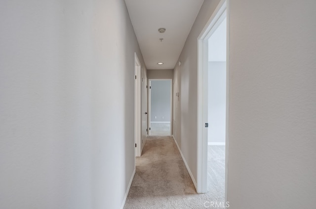 253 Gallery Way, Tustin, CA 92782 - corridor featuring light colored carpet, baseboards, and recessed lighting