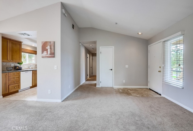 253 Gallery Way, Tustin, CA 92782 - unfurnished living room featuring lofted ceiling, light colored carpet, baseboards, and recessed lighting