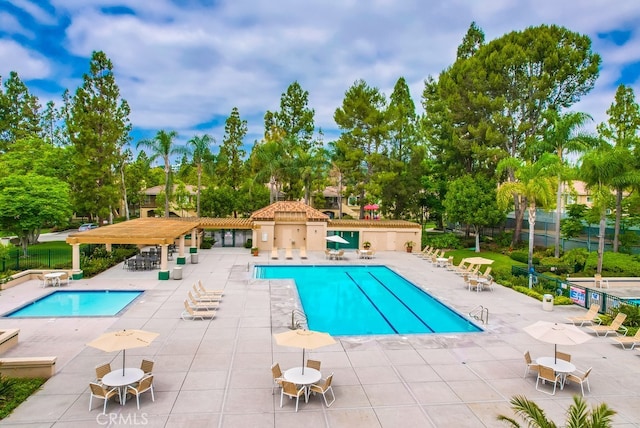 253 Gallery Way, Tustin, CA 92782 - community pool featuring a patio and view of wooded area