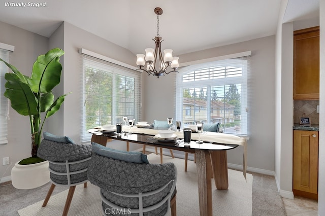 253 Gallery Way, Tustin, CA 92782 - dining area featuring a chandelier, baseboards, and light colored carpet