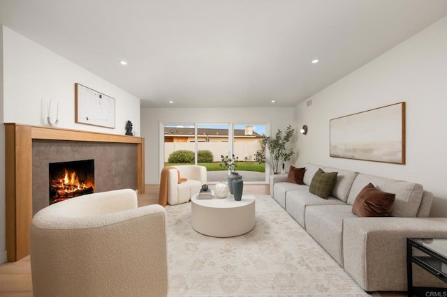4252 Don Jose Dr, Los Angeles, CA 90008 - living room featuring a lit fireplace, wood finished floors, and recessed lighting