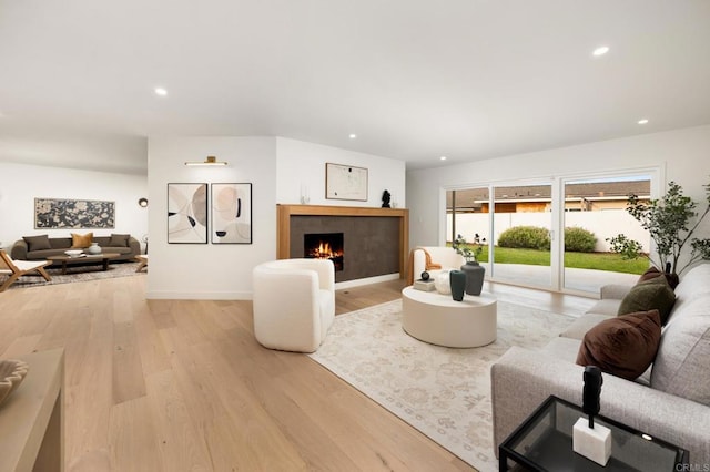 4252 Don Jose Dr, Los Angeles, CA 90008 - living room with light wood-type flooring, a lit fireplace, recessed lighting, and baseboards