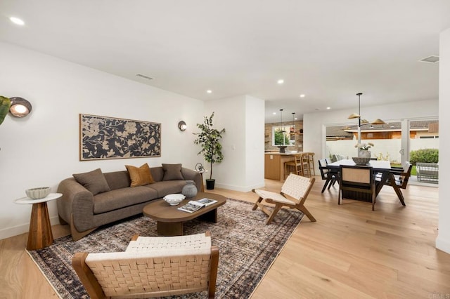 4252 Don Jose Dr, Los Angeles, CA 90008 - living area with light wood-type flooring, recessed lighting, and baseboards