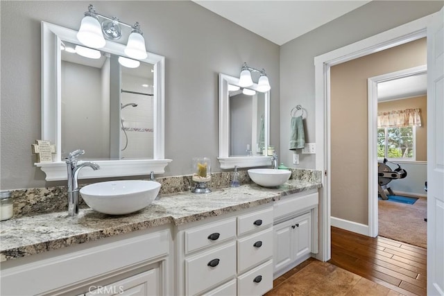 26 Deer View Ln, Templeton, CA 93465 - bathroom featuring double vanity, wood finished floors, and a tile shower