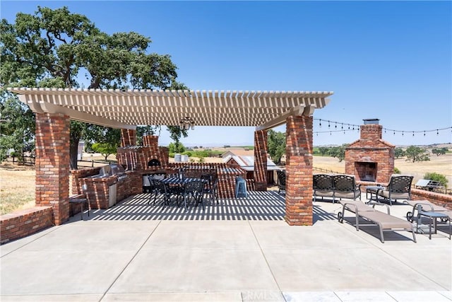 26 Deer View Ln, Templeton, CA 93465 - view of patio with an outdoor brick fireplace, a pergola, area for grilling, and outdoor dining space