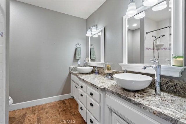 26 Deer View Ln, Templeton, CA 93465 - full bathroom with double vanity, baseboards, tiled shower, and toilet