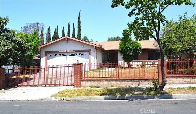 11401 Sunburst St, Sylmar, CA 91342 - single story home with a garage, stucco siding, driveway, and a fenced front yard