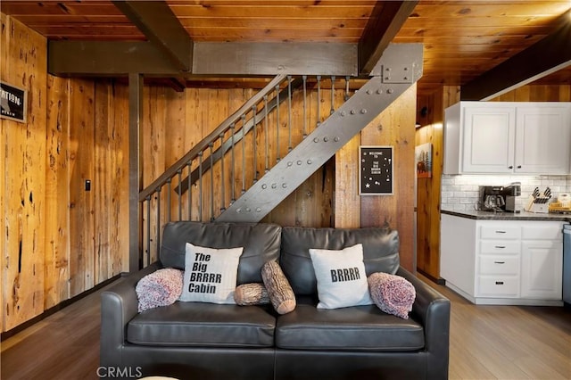 865 Bear Mtn, Big Bear City, CA 92314 - living room with wooden walls, stairs, light wood-style flooring, and wood ceiling with exposed beams