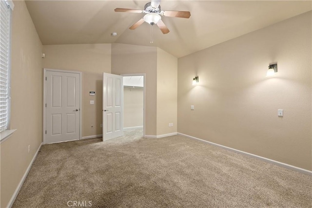 1033 Raven Ln, Chico, CA 95926 - unfurnished bedroom with carpet flooring, lofted ceiling, baseboards, a walk in closet, and a ceiling fan