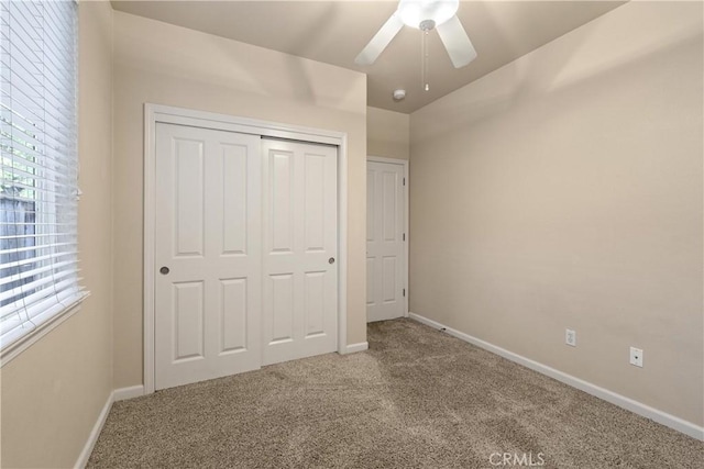1033 Raven Ln, Chico, CA 95926 - unfurnished bedroom featuring carpet, baseboards, a closet, and a ceiling fan