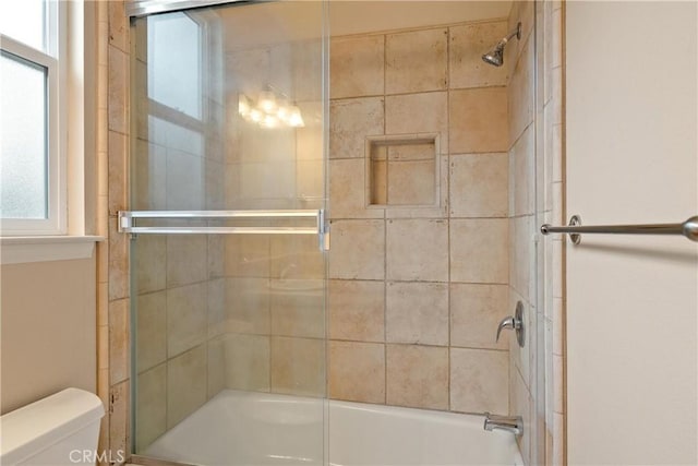 1033 Raven Ln, Chico, CA 95926 - bathroom featuring toilet and bath / shower combo with glass door