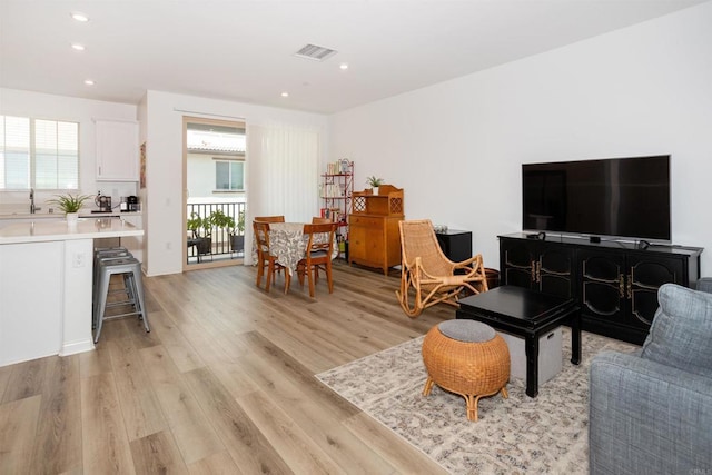 1807 Mesquite Way, Oceanside, CA 92056 - living room with light wood-style floors and recessed lighting