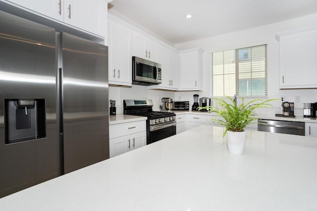 1807 Mesquite Way, Oceanside, CA 92056 - kitchen with stainless steel appliances, light countertops, white cabinetry, and recessed lighting