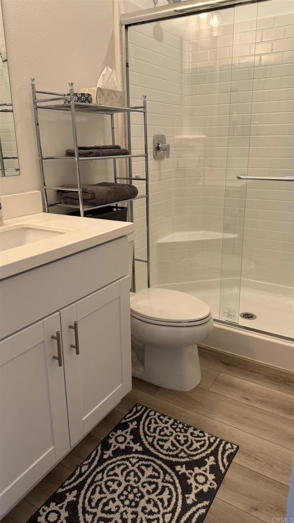 1807 Mesquite Way, Oceanside, CA 92056 - full bath featuring wood finished floors, vanity, and a shower stall
