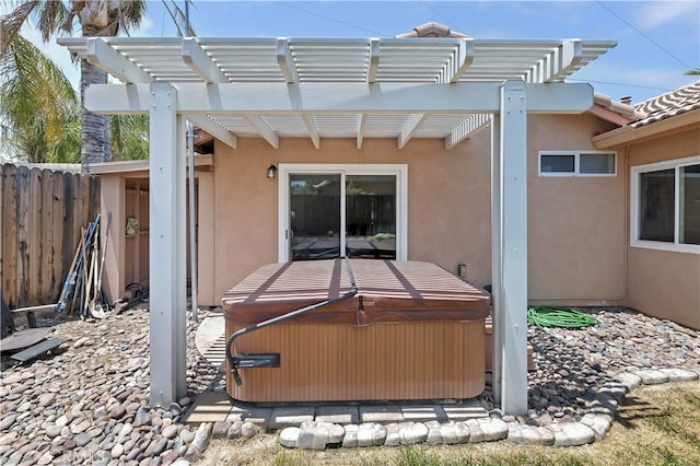 1361 Lindsey, San Jacinto, CA 92583 - back of property featuring a hot tub, stucco siding, and a pergola