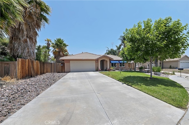 1361 Lindsey, San Jacinto, CA 92583 - ranch-style house featuring a tiled roof, an attached garage, concrete driveway, and stucco siding
