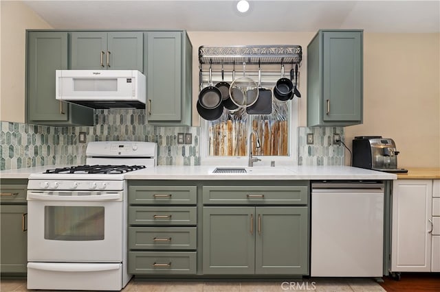 1361 Lindsey, San Jacinto, CA 92583 - kitchen featuring green cabinets, white appliances, and a sink