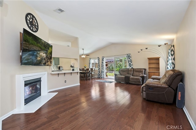 1361 Lindsey, San Jacinto, CA 92583 - living area with lofted ceiling, dark wood-type flooring, a glass covered fireplace, and baseboards