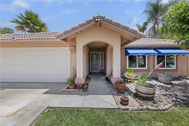 1361 Lindsey, San Jacinto, CA 92583 - doorway to property featuring a tiled roof, stucco siding, driveway, and an attached garage