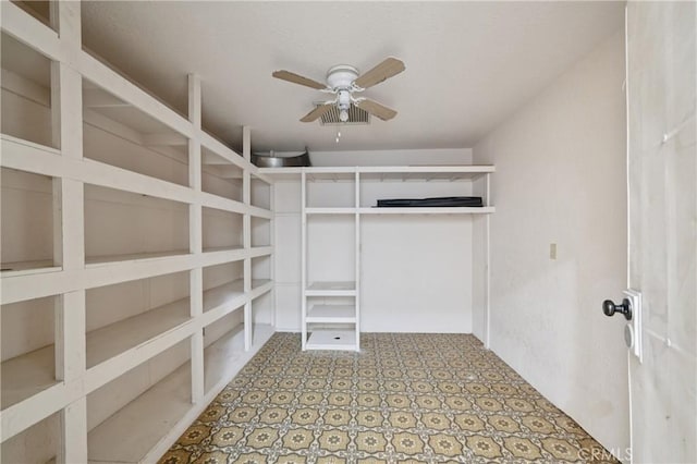 14676 Poplar St, Hesperia, CA 92345 - spacious closet featuring ceiling fan and tile patterned floors