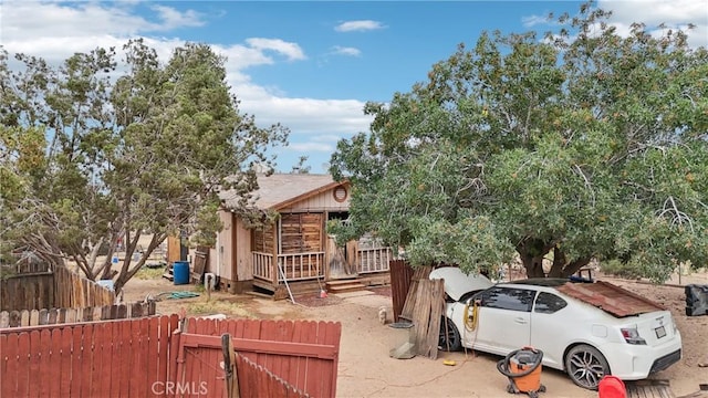 14676 Poplar St, Hesperia, CA 92345 - view of side of property with a gate