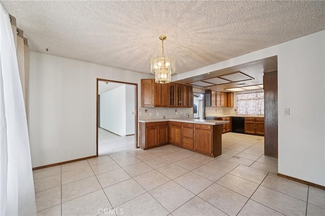14676 Poplar St, Hesperia, CA 92345 - kitchen with a peninsula, light countertops, brown cabinetry, dishwasher, and a chandelier
