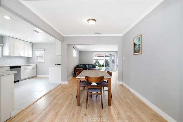 2804 W 84th St, Inglewood, CA 90305 - dining space featuring ornamental molding, light wood-style floors, baseboards, and recessed lighting